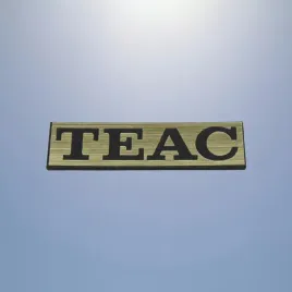 greatergreatergreater-teac-35x9mm-zloty-2-emblemat-naklejka-logo-znaczek-tabliczka-zamiennik