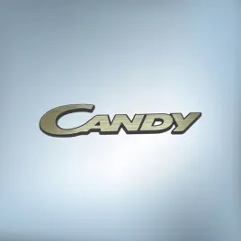 greatergreatergreater-candy-60x13mm-zloty-emblemat-naklejka-logo-znaczek-zamiennik