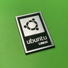 greatergreatergreater-linux-27x18mm-srebrny-emblemat-naklejka-logo-znaczek-symbol-zamiennik