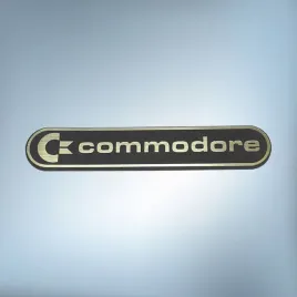 emblemat-naklejka-commodore-zloto-czarna-68x13mm-logo-znaczek