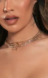 zloty-choker-z-dekoracjami-prettylittlething