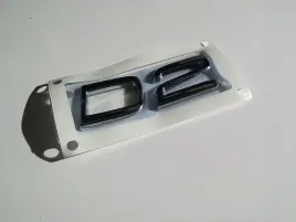 volvo-d2-emblemat-na-tylna-klape-31333138-oe