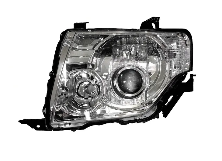 MITSUBISHI PAJERO REFLEKTOR GŁÓWNY LEWY REGULACJA ELEKTRYCZNA NOWY 2007 -
