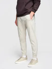 meskie-spodnie-dresowe-ze-sciagaczem-przy-nogawce-basic-jogger-kremowe