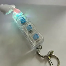 swiecacy-kliker-led-fidget-toy-antystresowy-klikacz-brelok-bialy