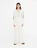 pull-and-bear-kremowy-kombinezon-paski-hafty-m