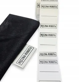 metki-wszywki-odziezowe-reczna-robota-na-rolce-nylono-x-50-szt-25x38mm