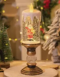 swieca-swiateczna-led-z-figurka-mikolaja-i-brokatowym-efektem-sniegu-25cm