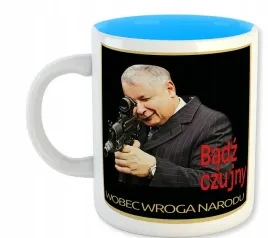 kubek-bialy-niebieski-srodek-pis-kaczor-zly-pan