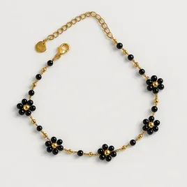 bransoletka-na-noge-czarne-kwiatuszki-koraliki-zlota-stal-chirurgiczna-316l