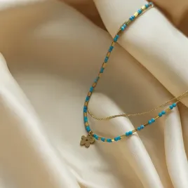 bransoletka-na-noge-podwojna-niebieskie-koraliki-zloty-kwiatek-stal-316l