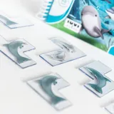 gra-zwinne-delfinki-smart-games-7-stan-nowy-material-papier