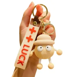 brelok-lucky-bezowy-ludzik-z-karabinczykiem-do-torebki-kluczy-etui-telefonu