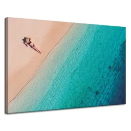 obraz-na-plotnie-kobieta-opalajaca-sie-na-plazy-120x80-cm