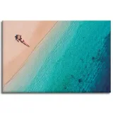 obraz-na-plotnie-kobieta-opalajaca-sie-na-plazy-120x80-cm-stan-nowy