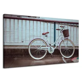 obraz-na-plotnie-vintage-rower-w-miescie-przy-moscie-120x70