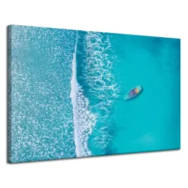 obraz-na-plotnie-niebieska-lodz-na-srodku-oceanu-120x80-cm