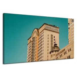 obraz-na-plotnie-architektura-hotel-120x70-cm-zolty-niebieski-kolor-budynki