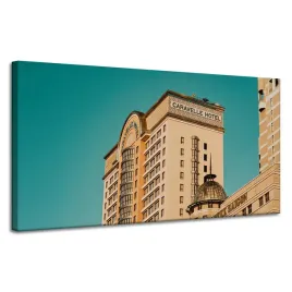 obraz-na-plotnie-architektura-hotel-120x60-cm-zolty-niebieski-kolor-budynki