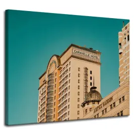 obraz-na-plotnie-architektura-hotel-100x80-cm-zolty-niebieski-kolor-budynki