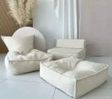 pufa-mala-dla-dziecka-boucle-krem-kolor-obicia-odcienie-bezu