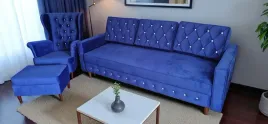 zestaw-wypoczynkowy-sofa-rozkladana-fotel-pikowany-z-podnozkiem