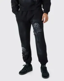 czarne-spodnie-dresowe-haft-roza-boohooman-m
