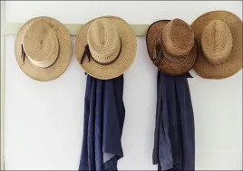 menandaposs-straw-hats-hanging-inside-the-farmhouse-at-yoderandaposs-amish-h