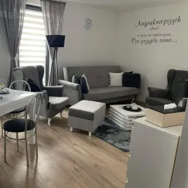 komplet-wypoczynkowy-zestaw-skandynawski-uszak-wersalka-fotel-pufa