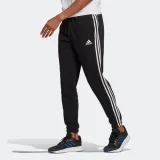 spodnie-adidas-essentials-tapered-elasticcuff-3-st-material-dominujacy-bawelna