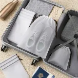 worki-podrozne-ze-sznurkiem-na-ubrania-akcesoria-bezbarwne-5szt-20x30cm-stan-nowy