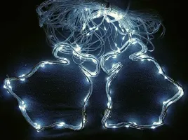 swiateczna-kurtyna-swietlna-8-bialych-dzwonkow-led-24m-z-przelotka