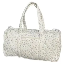 pikowana-torba-podrozna-z-paskiem-kremowa-w-kwiaty-i-kokardki-coquette