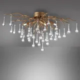 sufitowa-lampa-glamour-icicle-crystal-nad-stolik-mosiadz