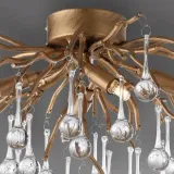 sufitowa-lampa-glamour-icicle-crystal-nad-stolik-mosiadz