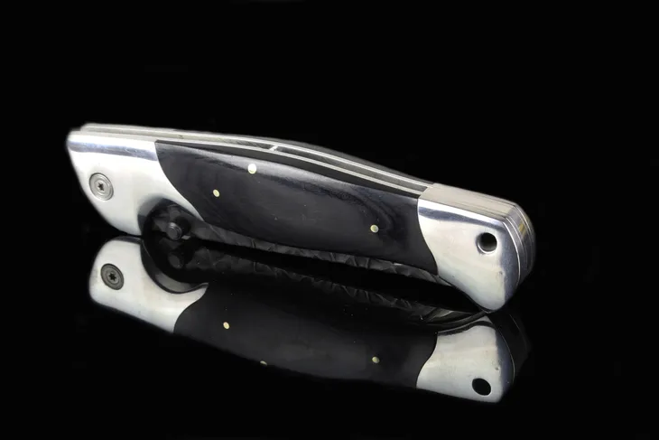noz-mysliwski-skladany-crystal-pantera-drewno-r9-material-glowni-stal