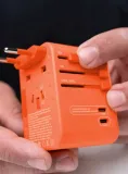 adapter-podrozny-matador-global-travel-adapter-forget-me-not-orange-model-global-travel-adapter-kod-producenta-matjy307001o