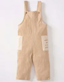 bezowy-kombinezon-tekstura-kieszenie-nadruk-bawelna-szelki-defacto-74-80