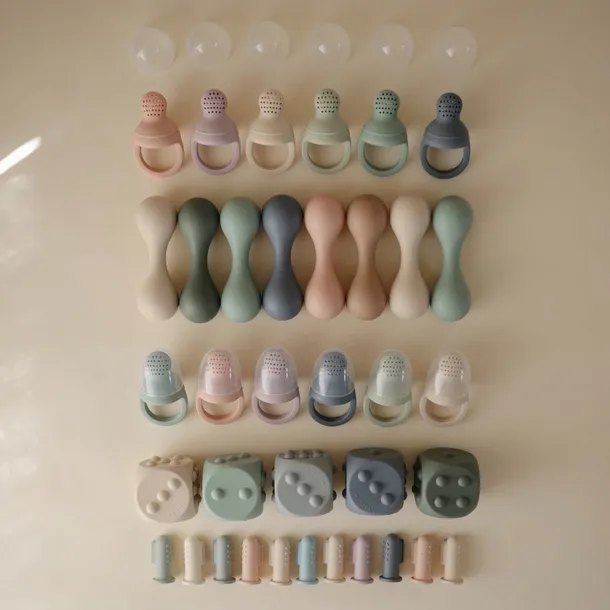 mushie-grzechotka-shifting-sand-material-inny