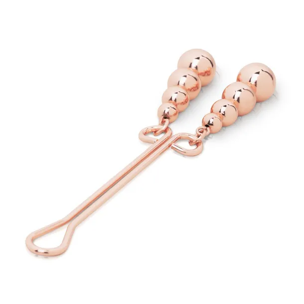 rosy-gold-clitoris-clamp-subtle-weight