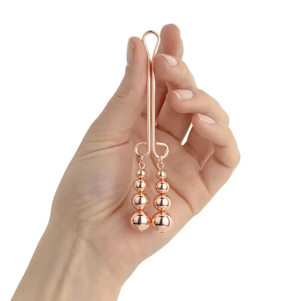 rosy-gold-clitoris-clamp-subtle-weight